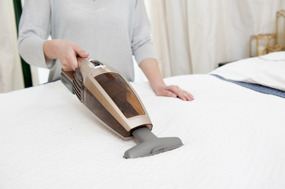 Clean Bed using Vacuum Cleaner 